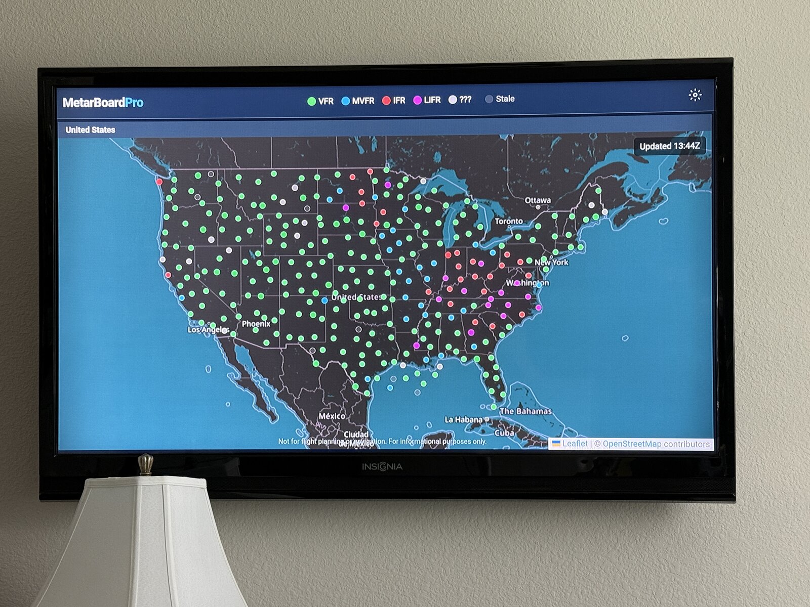 MetarBoard Pro displayed on a wall-mounted Fire TV in a pilot lounge
